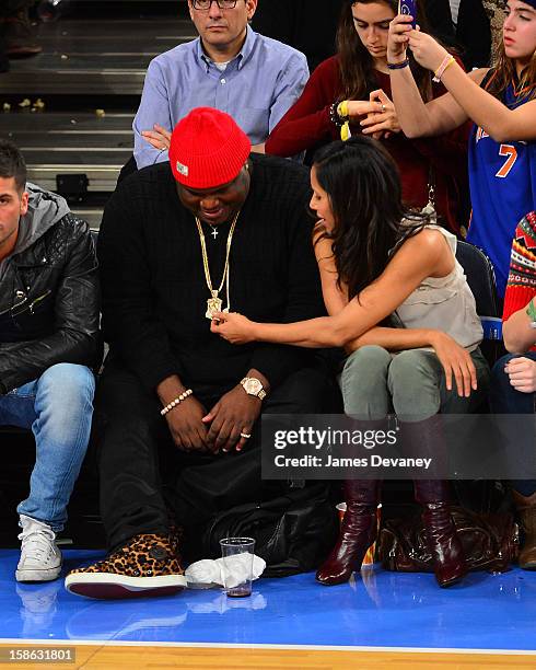 Padma Lakshmi and guest attend the Chicago Bulls vs New York Knicks game at Madison Square Garden on December 21, 2012 in New York City.