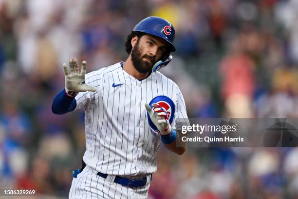 Dansby Swanson of the Chicago Cubs reacts after his a two-run home run in the first inning against Ben Lively of the Cincinnati Reds at Wrigley Field...