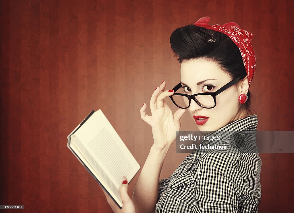 Vintage brunette reading a book