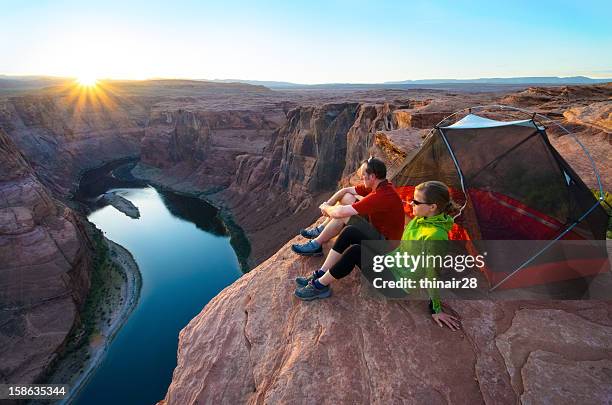 camping at the edge - couple grand canyon stock pictures, royalty-free photos & images