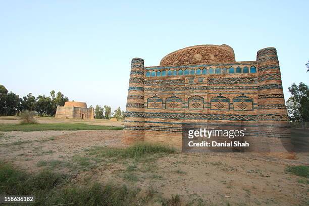 squared blue and red tiled symmetrical structure - dera ismail khan stock pictures, royalty-free photos & images
