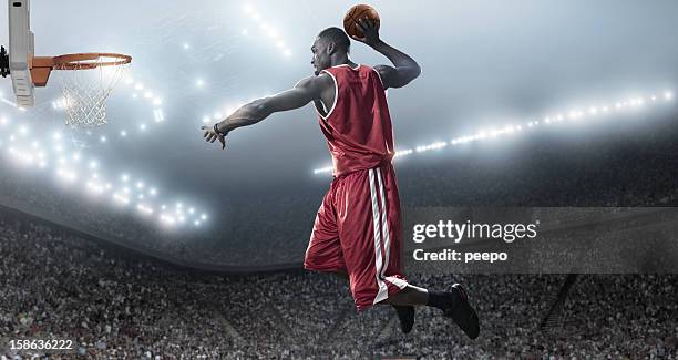 basketball player about to slam dunk - basketball net stockfoto's en -beelden
