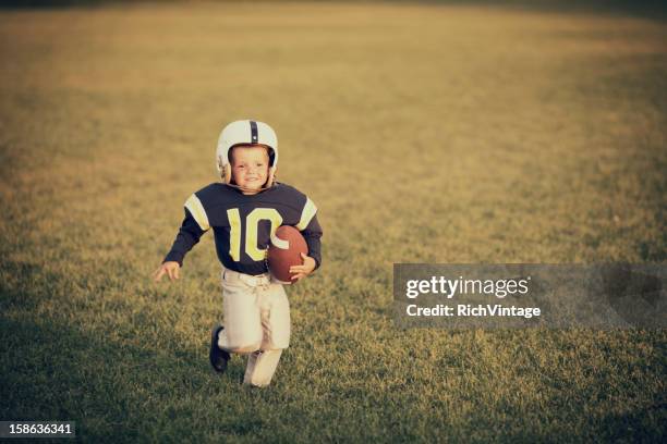 vintage footballer - rush american football stock pictures, royalty-free photos & images