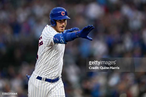 Cody Bellinger of the Chicago Cubs reacts after a two-run home run in the second inning against Ben Lively of the Cincinnati Reds at Wrigley Field on...