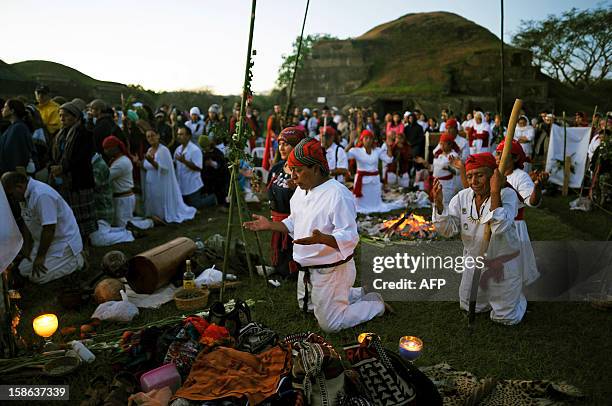 Indegenous shamans pray to welcome dawn, during the fire ceremony at the San Andres Archeological site in the town of Opico 32 Kms. West from San...