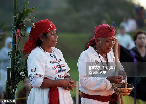 Indegenous shamans pray to welcome dawn, during the fire ceremony at the San Andres Archeological site in the town of Opico 32 Kms. West from San...