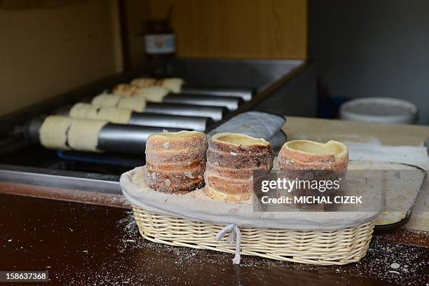 Czech traditional pastry ''Trdelnik'' are for sale at a Christmas Market in Prague on December 22, 2012. AFP PHOTO MICHAL CIZEK