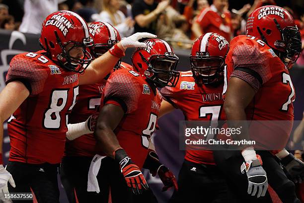 Harry Peoples of the Louisiana-Lafayette Ragin Cajuns celebrates after scoring a touchdown against the East Carolina Pirates during the R+L Carriers...