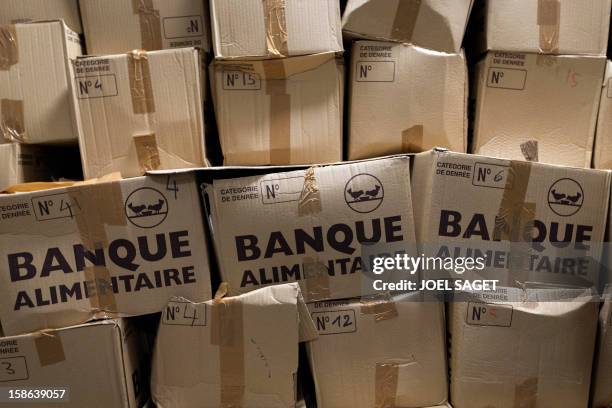 Picture of cartons from bank food taken at the homeless shelter "Les enfants du canal" , on December 22, 2012 in Paris. AFP PHOTO / JOEL SAGET