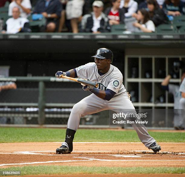 Trayvon Robinson of the Seattle Mariners attempts a bunt during the game against the Chicago White Sox on Sunday, August 26, 2012 at U.S. Cellular...