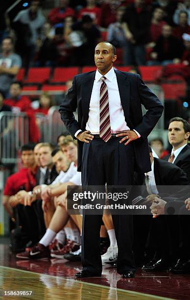 Coach Johnny Dawkins of the Stanford Cardinal watches his team play against the North Carolina State Wolfpack at PNC Arena on December 18, 2012 in...