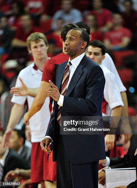 Coach Johnny Dawkins of the Stanford Cardinal directs his team against the North Carolina State Wolfpack at PNC Arena on December 18, 2012 in...