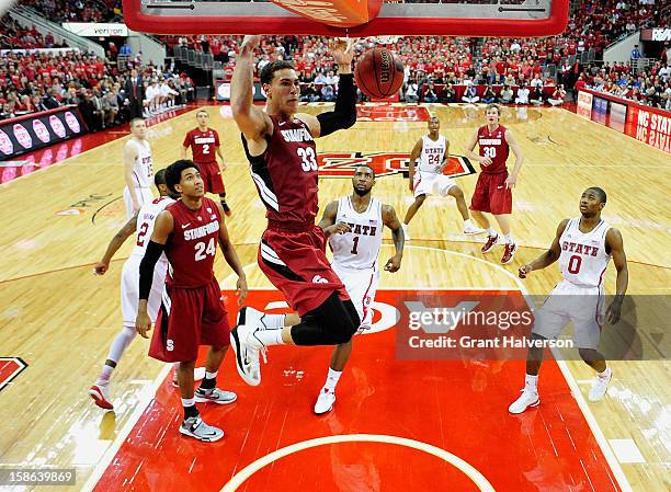 Dwight Powell of the Stanford Cardinal dunks against the North Carolina State Wolfpack during play at PNC Arena on December 18, 2012 in Raleigh,...