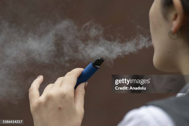 Woman smokes vape cigarette in London, England on August 08, 2023. The Local Government Association , which represents councils in England and Wales,...