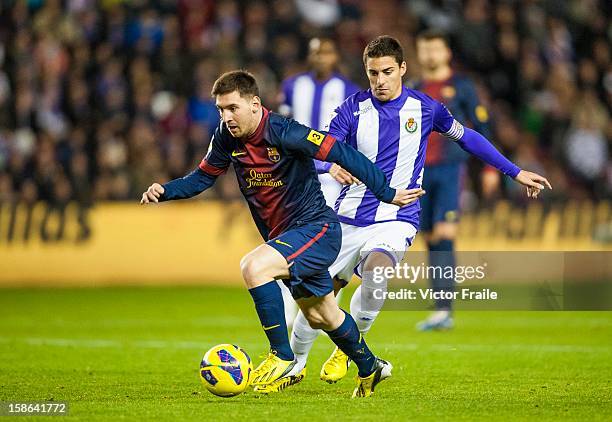Lionel Messi of Barcelona fights for the ball during the La Liga game between Real Valladolid and FC Barcelona at Jose Zorrilla on December 22, 2012...