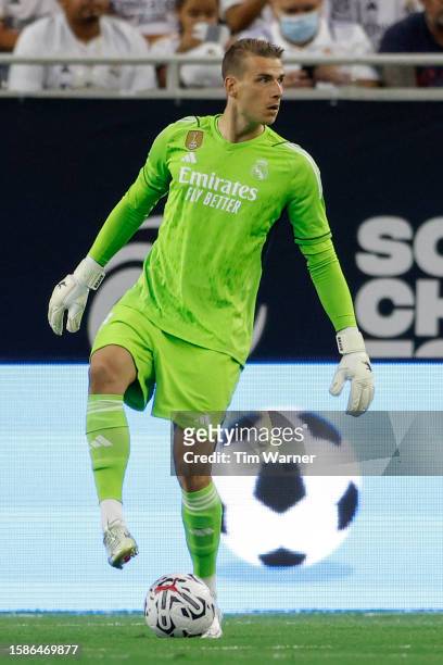 Andriy Lunin of Real Madrid controls the ball in the first half against Manchester United during the 2023 Soccer Champions Tour match at NRG Stadium...
