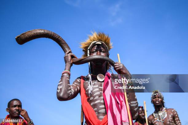 Performer from the Masai Community makes music with a traditional instrument during the International Day of the World's Indigenous Peoples at...