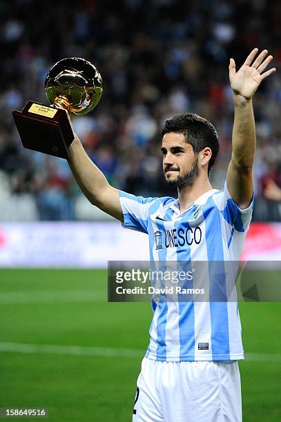 Francisco R. Alarcon Isco of Malaga CF holds up the 'Golen boy' trophy for being the best U-21 European player given by the sports daily newspaper...
