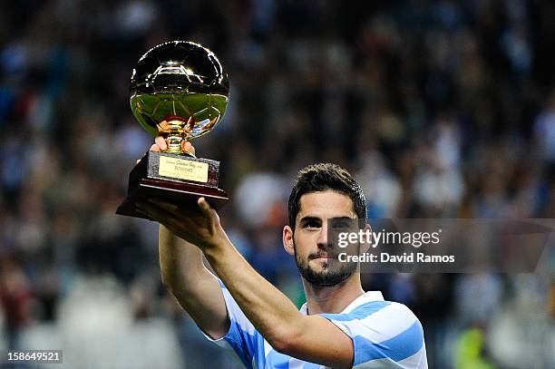 Francisco R. Alarcon Isco of Malaga CF holds up the 'Golen boy' trophy for being the best U-21 European player given by the sports daily newspaper...