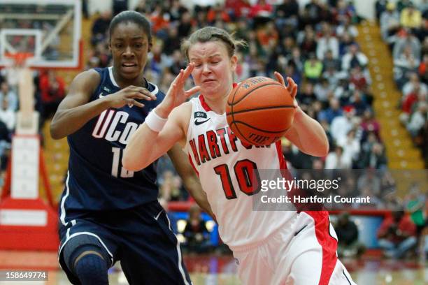 Hartford's Alex Hall, right, drives against Connecticut's Brianna Banks during the second half at the Chase Family Arena in West Hartford,...