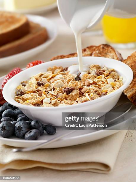 almond and raisin breakfast cereal - bran stock pictures, royalty-free photos & images