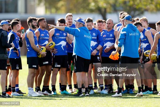 Assistant coach, Brett Ratten gives instructions during a North Melbourne Kangaroos AFL training session at Arden Street Ground on August 02, 2023 in...