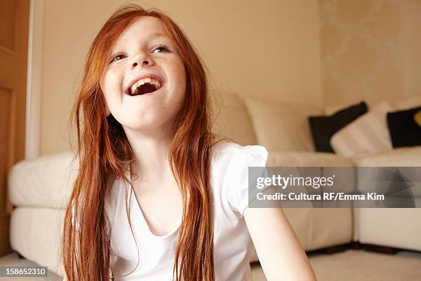 girl smiling on living room floor - girl open mouth bildbanksfoton och bilder