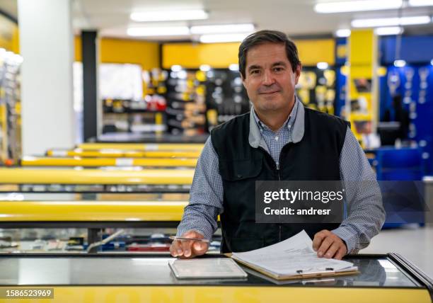 business owner working at a hardware store - stationary stock pictures, royalty-free photos & images