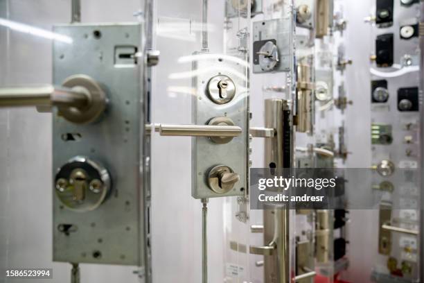 display of security locks at a hardware store - locksmith stock pictures, royalty-free photos & images