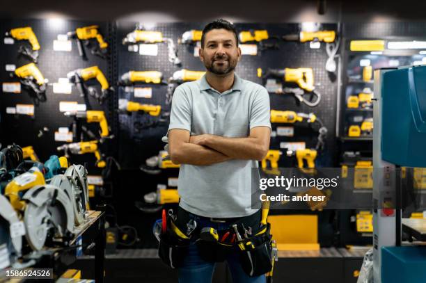 portrait of a retail clerk working at a hardware store - hardware shop stock pictures, royalty-free photos & images