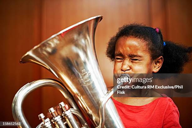 girl playing tuba - blaasinstrument stockfoto's en -beelden