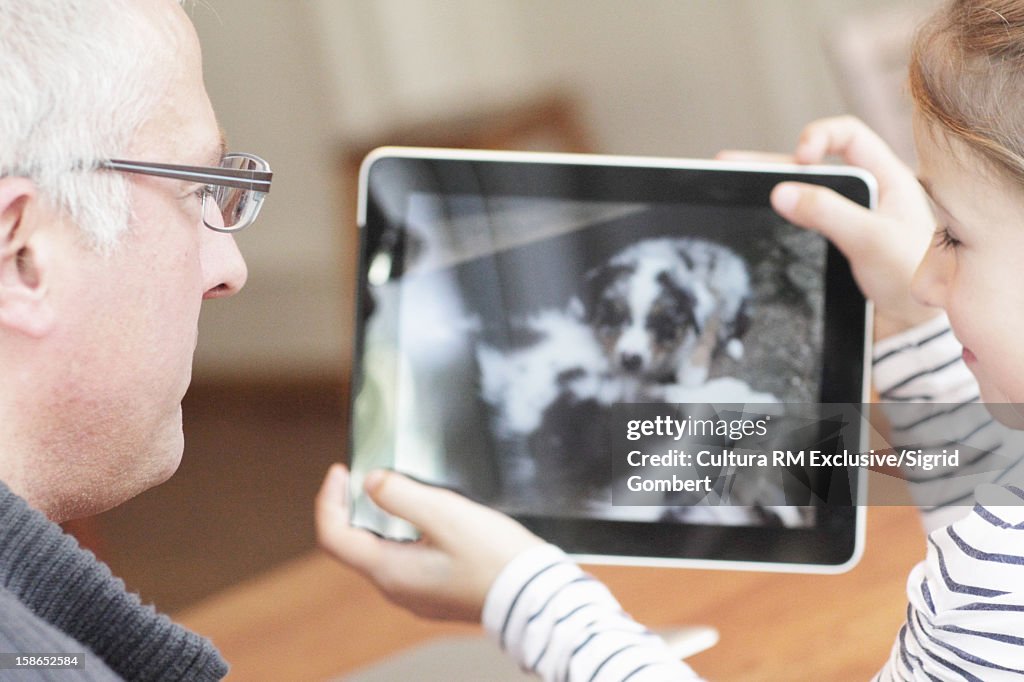 Father and daughter with tablet computer