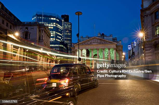 time lapse view of urban traffic - traffic time lapse stock pictures, royalty-free photos & images