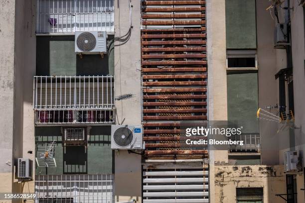 Scarce air conditioning units on the exterior of a residential building in the Poligono Sur neighborhoods of Seville, Spain, on Tuesday, July 4,...
