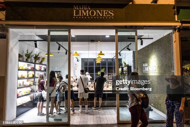 Customers queue at an ice cream store in the evening in Seville, Spain, on Tuesday, July 4, 2023. Seville is among the cities hardest hit by the heat...