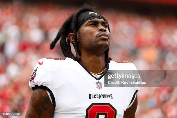 Julio Jones of the Tampa Bay Buccaneers stands on the sidelines during the national anthem prior to an NFL football game against the Carolina...