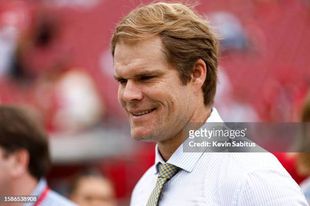 Fox Sports broadcaster Greg Olsen smiles on the field prior to an NFL football game between the Tampa Bay Buccaneers and the Carolina Panthers at...