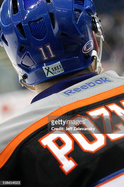 Casey Cizikas of the Bridgeport Sound Tigers wears a jersey in memory of Sandy Hook Elementary School shooting victim Noah Pozner during an American...