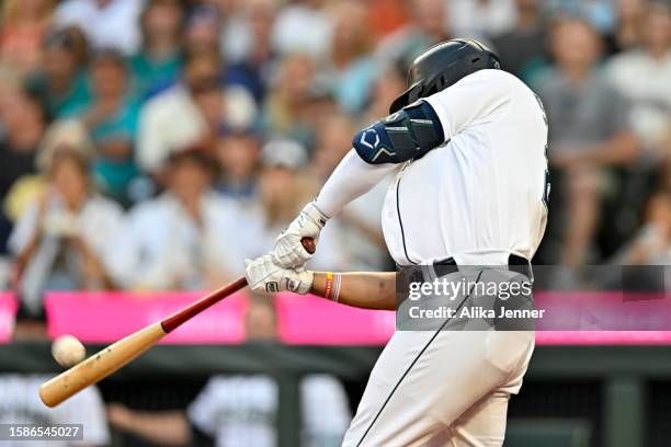 Eugenio Suarez of the Seattle Mariners hits a two-run home run during the fifth inning against the Boston Red Sox at T-Mobile Park on August 01, 2023...