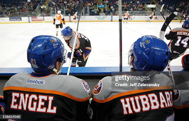 John Persson and Johan Sundstrom of the Bridgeport Sound Tigers wear jerseys in memory of Sandy Hook Elementary School shooting victims Olivia Engel...