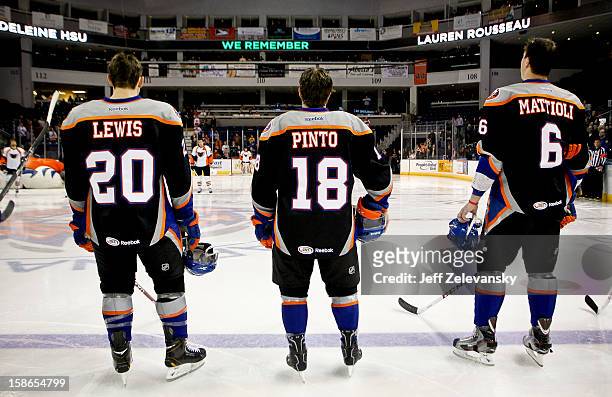 Members of the Bridgeport Sound Tigers wear jerseys emblazoned with the names of Sandy Hook Elementary School shooting victims Jesse Lewis, Jack...