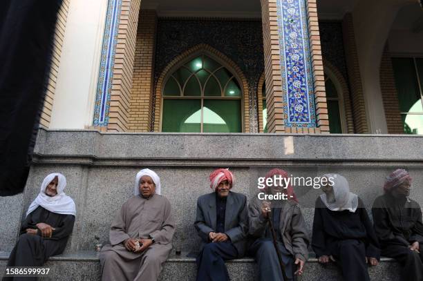 Elderly Bahraini Shiite Muslim men sit attend religious ceremonies commemorating Ashura, which marks the 7th century killing of Imam Hussein,...