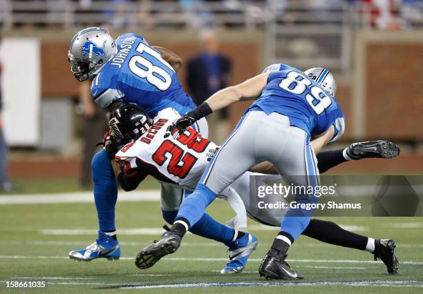 Calvin Johnson of the Detroit Lions catches a second quarter pass behind Thomas DeCoud of the Atlanta Falcons at Ford Field on December 22, 2012 in...
