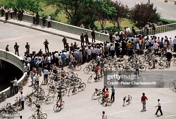 At the end of the pro-democracy movement in China, Chinese soldiers block an overpass on Chang'an Avenue leading to Tiananmen Square where the...