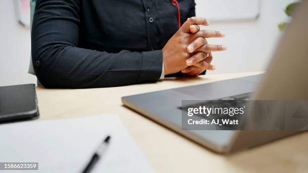 close-up of a young woman sitting at desk using laptop - e learning africa stock pictures, royalty-free photos & images