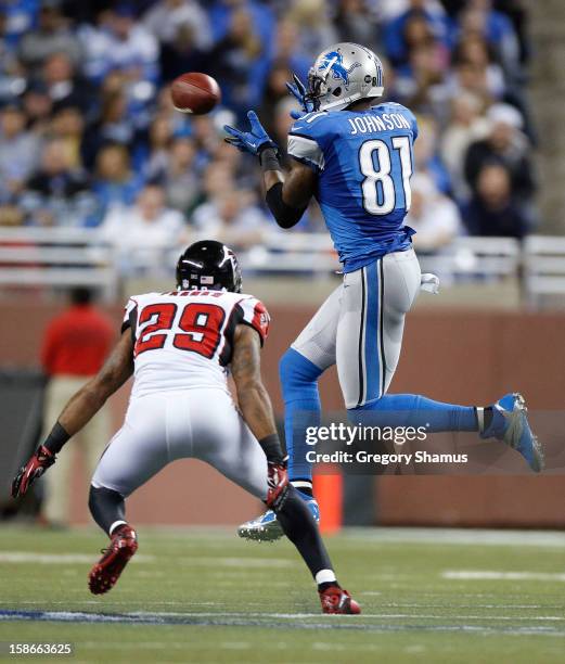 Calvin Johnson of the Detroit Lions makes a third quarter catch in front of Dominique Franks of the Atlanta Falcons at Ford Field on December 22,...