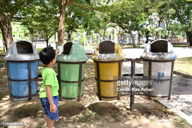 throw garbage in its place - throwing rubbish stock pictures, royalty-free photos & images
