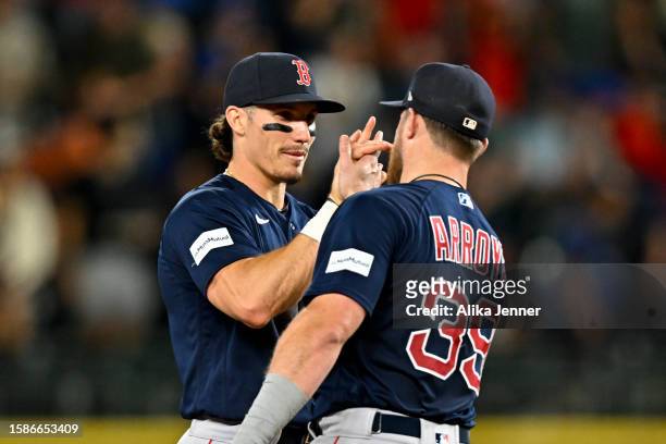 Jarren Duran of the Boston Red Sox and Christian Arroyo of the Boston Red Sox celebrate after the game against the Seattle Mariners at T-Mobile Park...