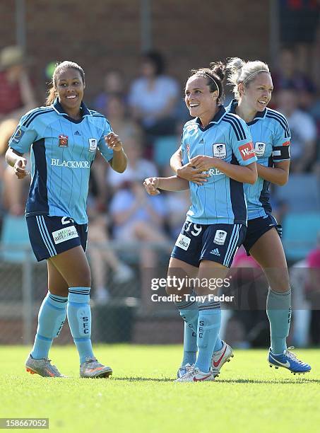 Lillie Billson, Emma Kete and Kyah Simon of Sydney celebrate a goal during the round 10 W-League match between the Newcastle Jets and Sydney FC at...