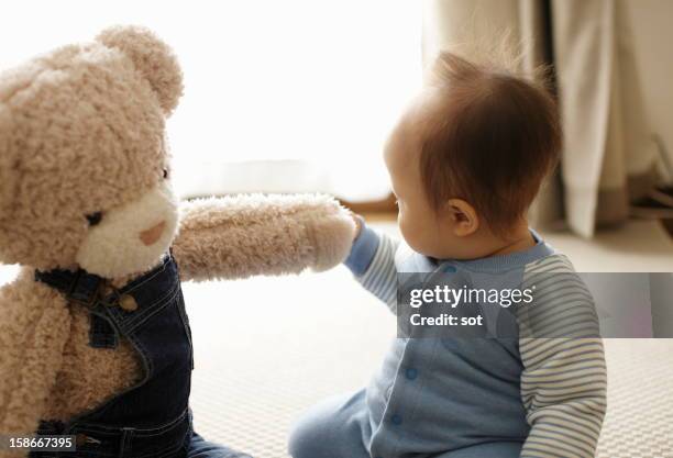 baby boy with teddy bear - 1歳以上2歳未満 ストックフォトと画像